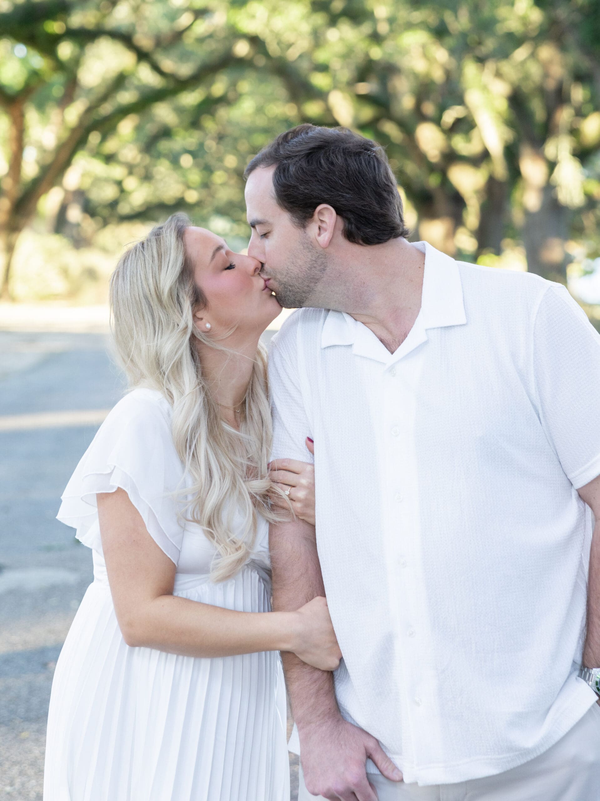 “Taylor and Harrison kissing during their engagement photoshoot at Springhill College in Mobile, AL.”